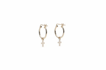 dainty small cross charms lightly dangle from thin gold hoops. Faith Hoops xo, Mango