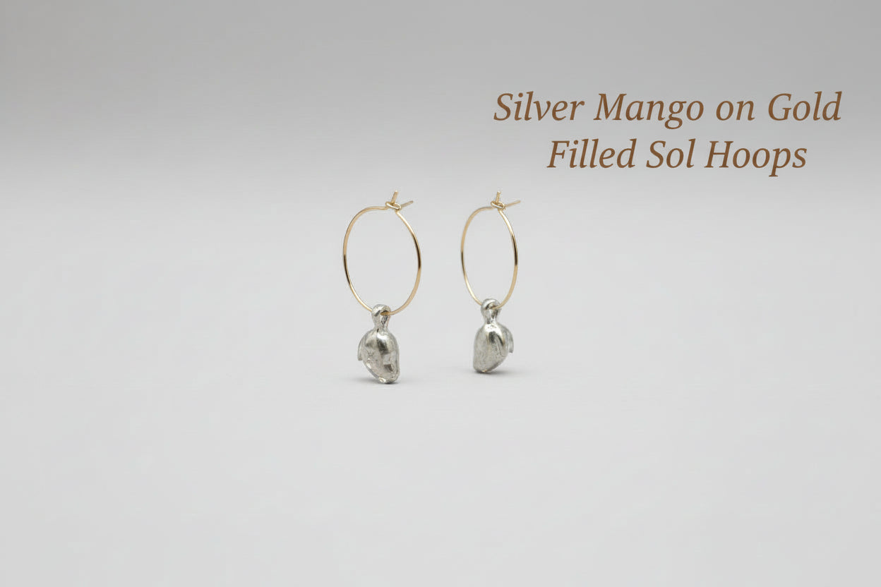 Silver hoop earrings with mango charm by xomango
