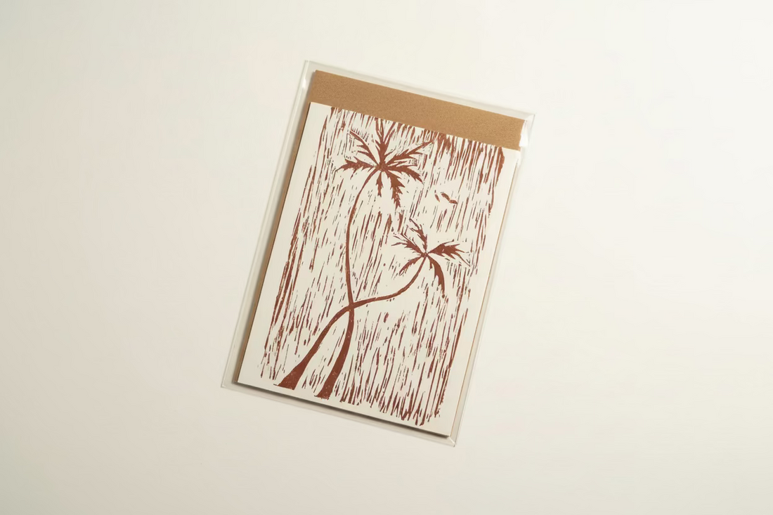 Card with palm tree design on a beige background