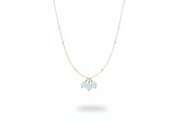 three pikake mother of pearl beads hang from a gold satellite necklace chain. symbolic jewelry representing a mothers love. by xo mango